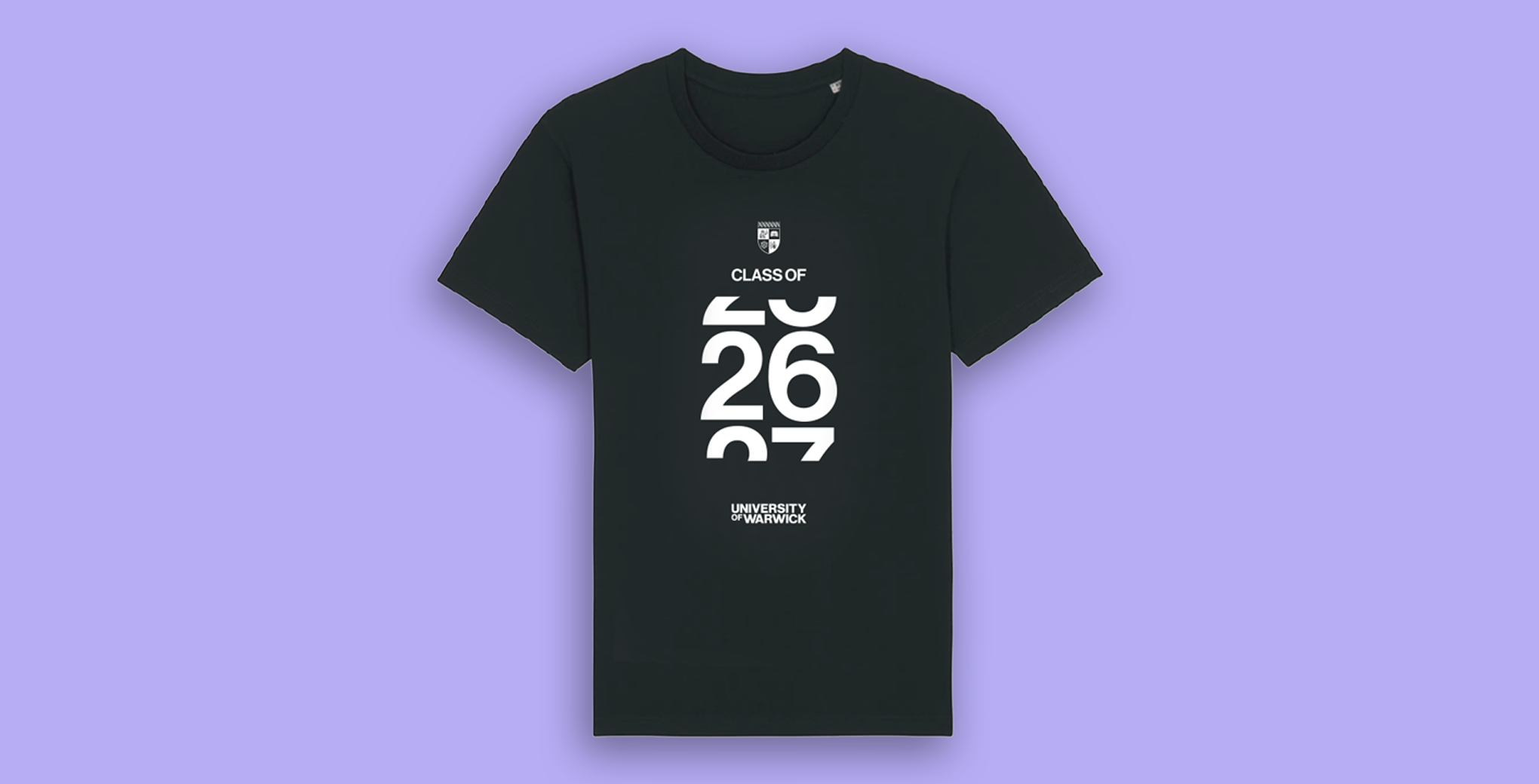 A black short-sleeve t-shirt with a white graphic print on the front reading 'CLASS OF 26' and 'UNIVERSITY OF WARWICK', and a white University of Warwick crest on the top, shown against a solid lavender background.