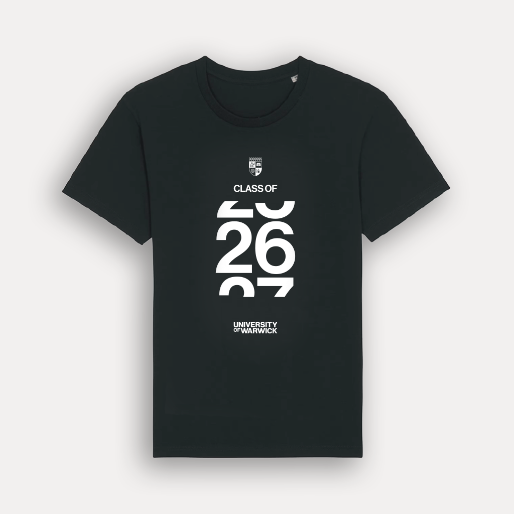 A black short-sleeve crewneck t-shirt with a white graphic print on the front. The graphic features a small crest, the text 'CLASS OF', large stylised numbers '26 27', and 'UNIVERSITY OF WARWICK' at the bottom. Shown on a light grey background. 